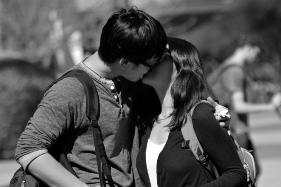 Xinyi Li, physics freshman, and Elizabeth Luna, physiology and molecular and cellular biology senior, share a kiss on the UA Mall on Tuesday, Feb. 9.