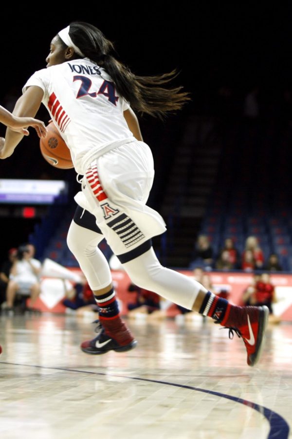 Arizona forward LaBrittney Jones dribbles past a USC player during the Wildcats 67-57 loss to the Trojans on Feb 5 at McKale Center. Arizona fell to Stanford for the second tim on Friday with a final score of 82-58.