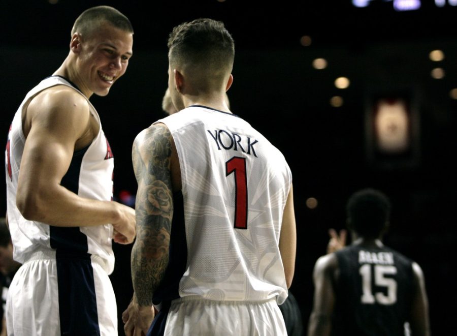 Gabe York (1) and Kaleb Tarczewski (35) share a smile while playing against California in McKale Center on Saturday, March 5. The two will look to finish their collegiate careers on a high note in March. 