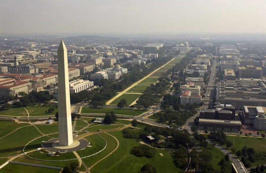 Aerial view of the Washington Monument with the Capitol in the background. 
