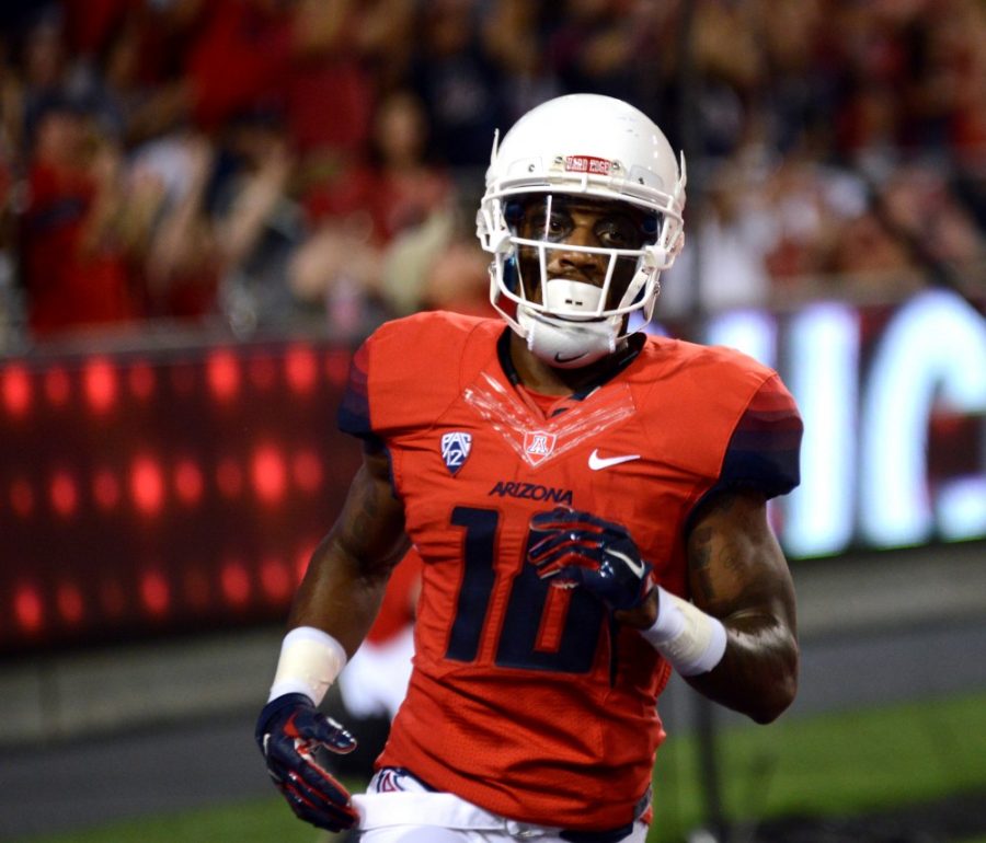 Arizona receiver Samajie Grant (10) runs out of the end zone after catching the first touchdown of the game against NAU on Sept. 19, 2015. Grant will look to be the leader at receiver for Arizona football this upcoming season. 