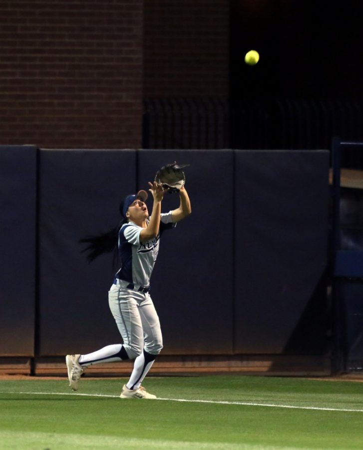 Arizona outfielder Merrilee Miller (20) catches a fly ball against Utah at Hillenbrand Stadium, located at 1700 E. Second Street in Tucson, Ariz. 
Photo taken Friday, March 25, 2016.
Photo by Alex McIntyre / For the Arizona Daily Star
