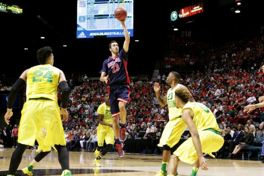 Arizona forward Mark Tollefson (23) prepares for a one-handed shot during the PAC-12 tournament semi-finals against Oregon in Las Vegas. The Wildcats are down 29-44 at half-time.