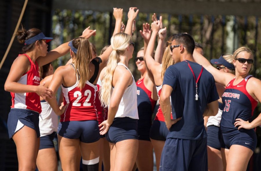 Arizona sand volleyball athletes and coach huddle up before their second annual Red-Blue game on Feb. 27. The team is ranked No. 9 in the nation.
