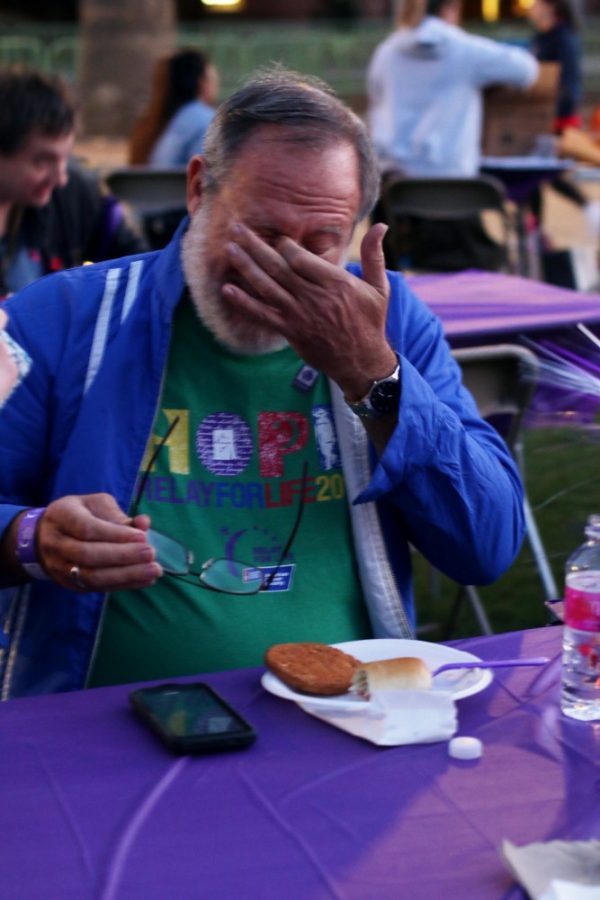Cancer survivor Jeff Goldberg tears up at Relay For Life on the UA Mall on Friday.