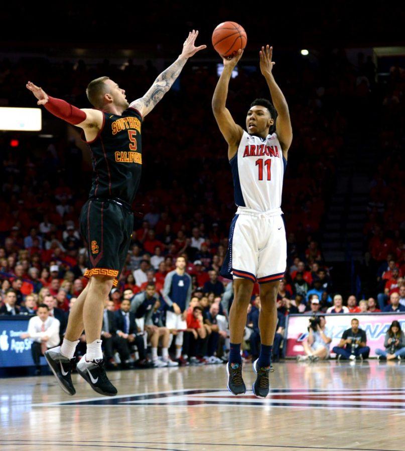 Arizona+guard+Allonzo+Trier+%2811%29+shoots+over+a+USC+player+in+McKale+Center+on+Sunday%2C+Feb.+14.+Trier+announced+Monday+that+he+will+return+to+the+program+for+his+sophomore+season.