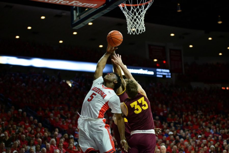 Arizona forward Stanley Johnson (5) reaches for a lay up against ASU in January 2015. 