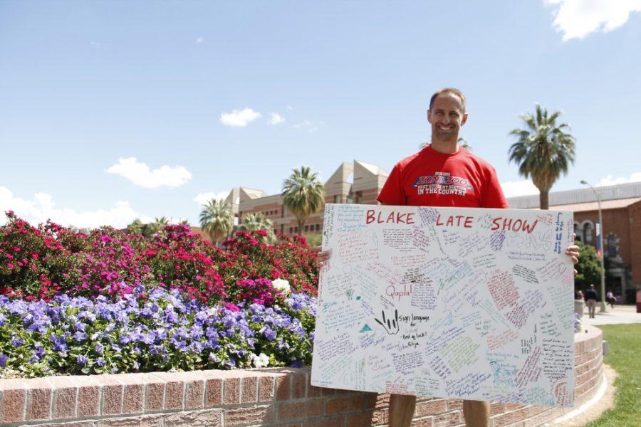 Ron Blake holds a signed poster board on the UA Mall on Tuesday, April 12. Blake suffers from post-traumatic stress disorder and is using signatures from strangers in support of mental health awareness.