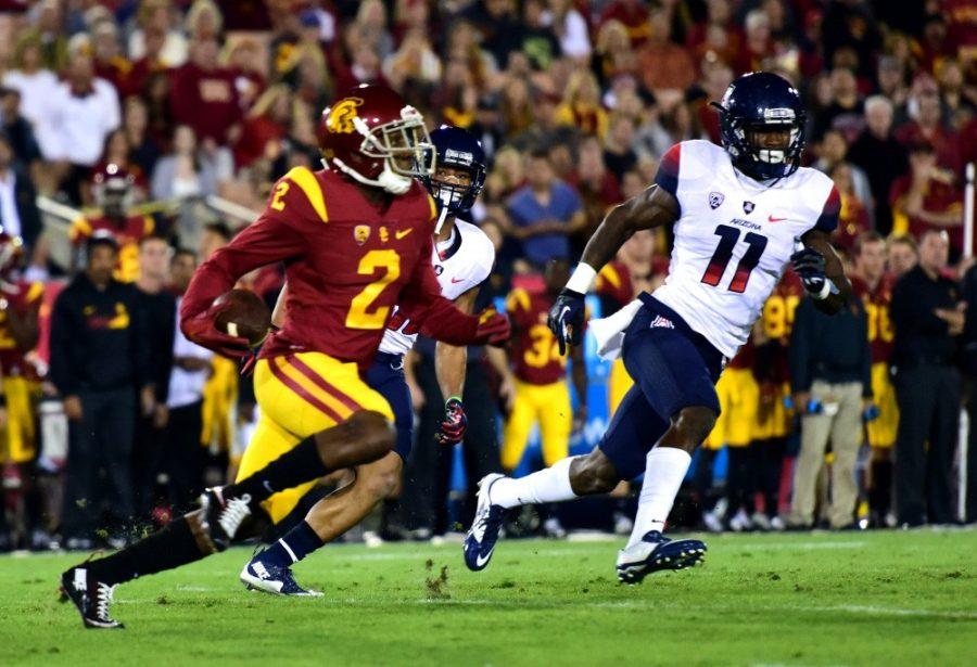 Arizona safety Will Parks (11) closes in on USC wide receiver and cornerback Adoree' Jackson (2) at the Los Angeles Memorial Coliseum Saturday, Nov. 7.