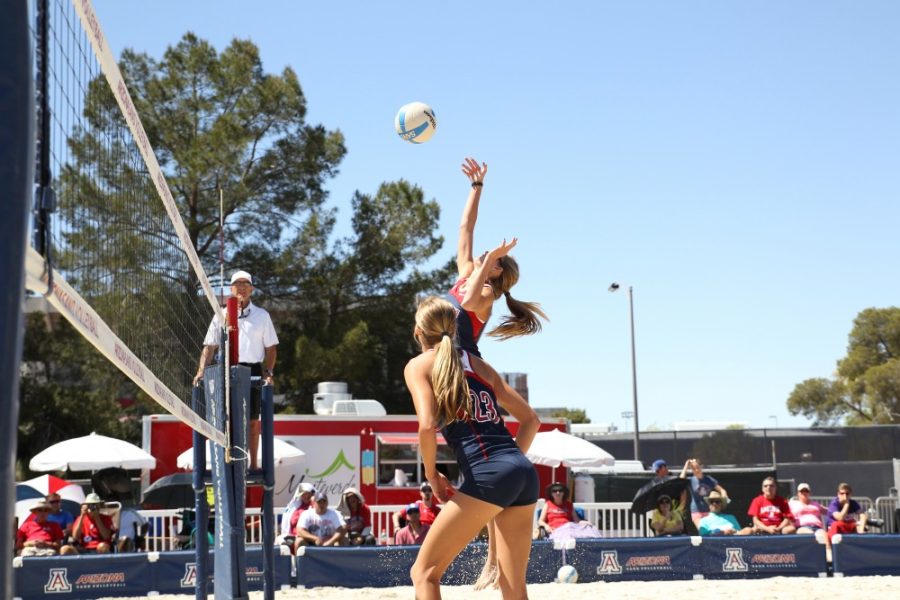 Arizona twin athletes Madison (23) and McKenna (21) Witt play a doubles match against California State Northridge in Tucson on Saturday, March 26. Arizona sand volleyball defeated ASU last Thursday.