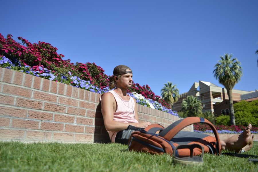 Engineering Freshman Ryan Smiley relaxes and meditates on the UA mall grass on Monday April 18th. Smileys says he to meditate there when its nice outside and also because he gets to greet his friends when they walk by.
