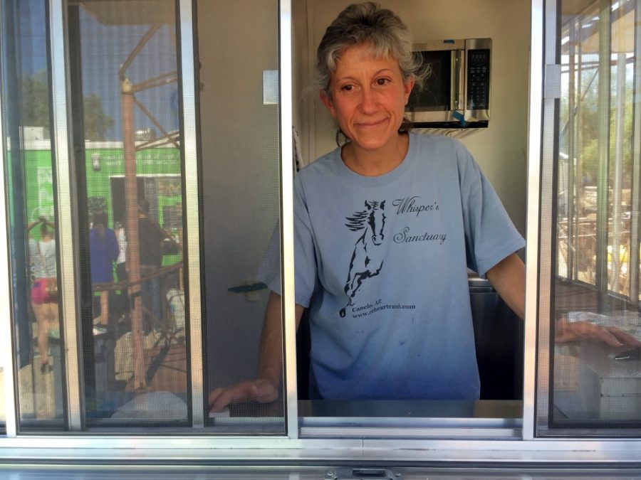 Toni Leo, owner of Sparky’s Cantina, stands at the window of her vegan food truck at VegFest on Sunday, April 25.