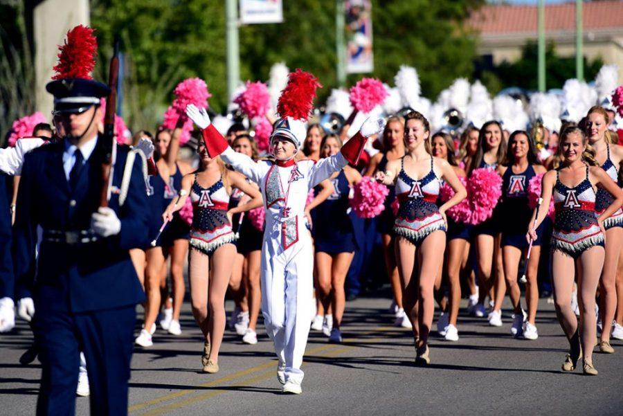 Junior Abby Hill leads the Pride of Arizona down the UA Mall during the 2015 Homecoming Parade.
