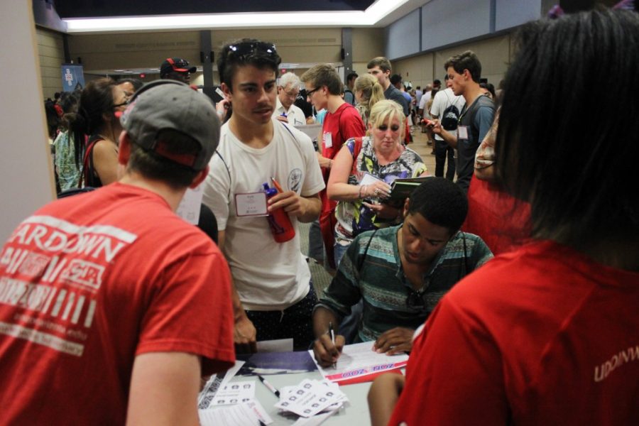 Jacob Borcover and Inyene Udoinwanganswer questions from incoming freshman and parents during the UA Orientation Fair on Monday.

