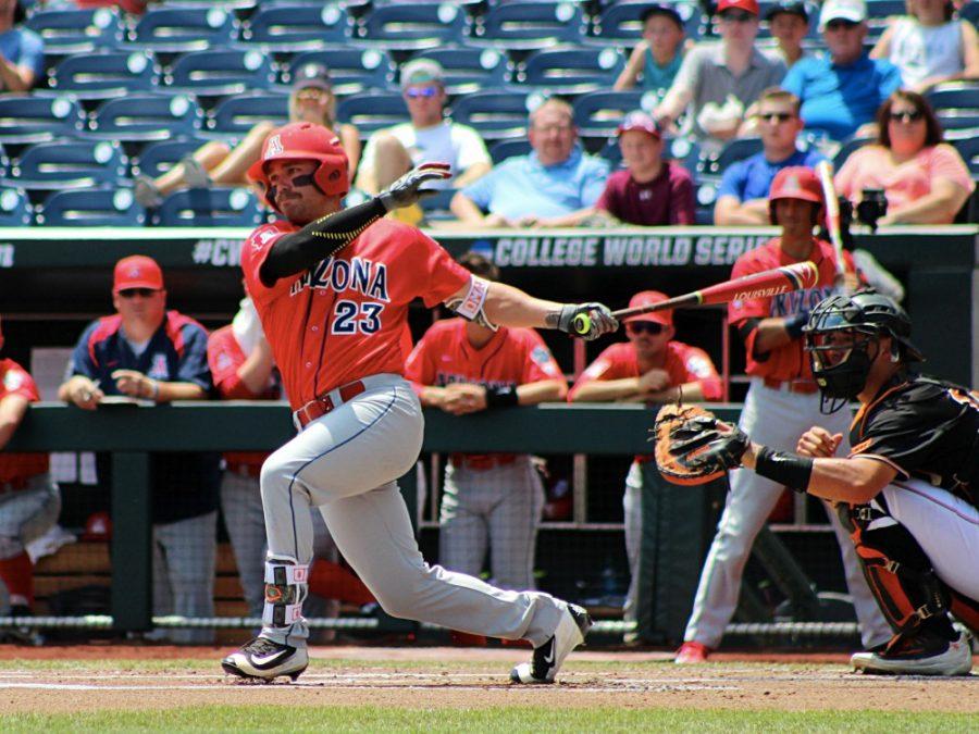 Arizona outfielder Zach Gibbons (23) follows through on his swing against Oklahoma State at the College World Series in Omaha, Nebraska on Friday, June 24. Gibbons had three hits and two RBI in the Wildcats 9-3 victory over the Cowboys.