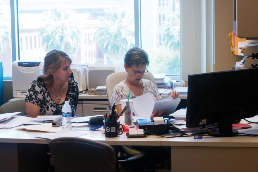 Accounting Specialist Dena Engel (Left) and Finance and Administrative Services Associate Director Patti Waters (Right) review credit card transactions on Tuesday, June 7 in the Student Union Memorial Center Administration Office.
