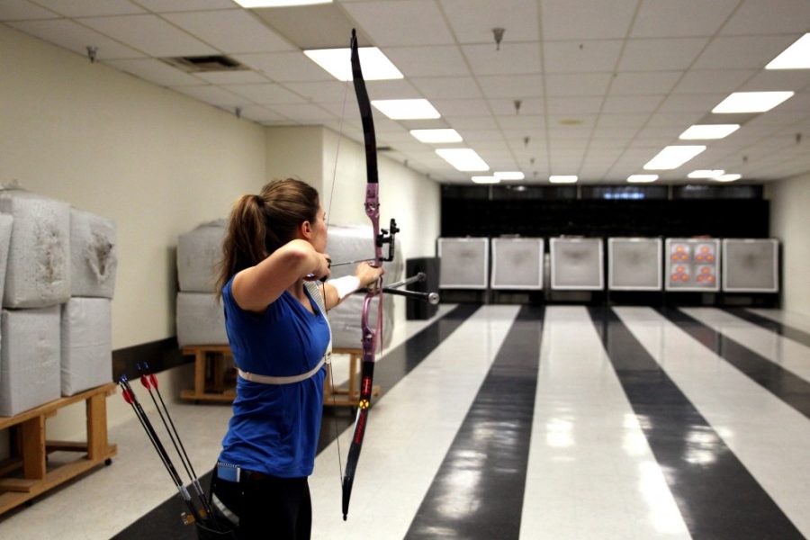 Madison Eich, a member of the Wildcat Archery Club, aims down range on Saturday, Jan. 30 at PSE Archery.