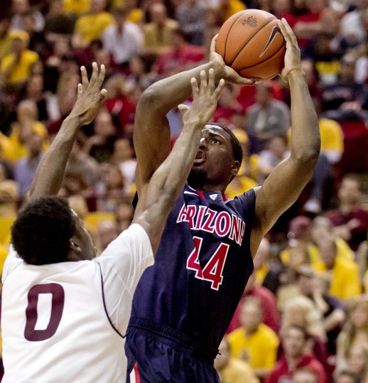 Former Wildcat Solomon Hill shoots the ball against ASU on Jan. 19, 2013 in Tempe, Ariz.