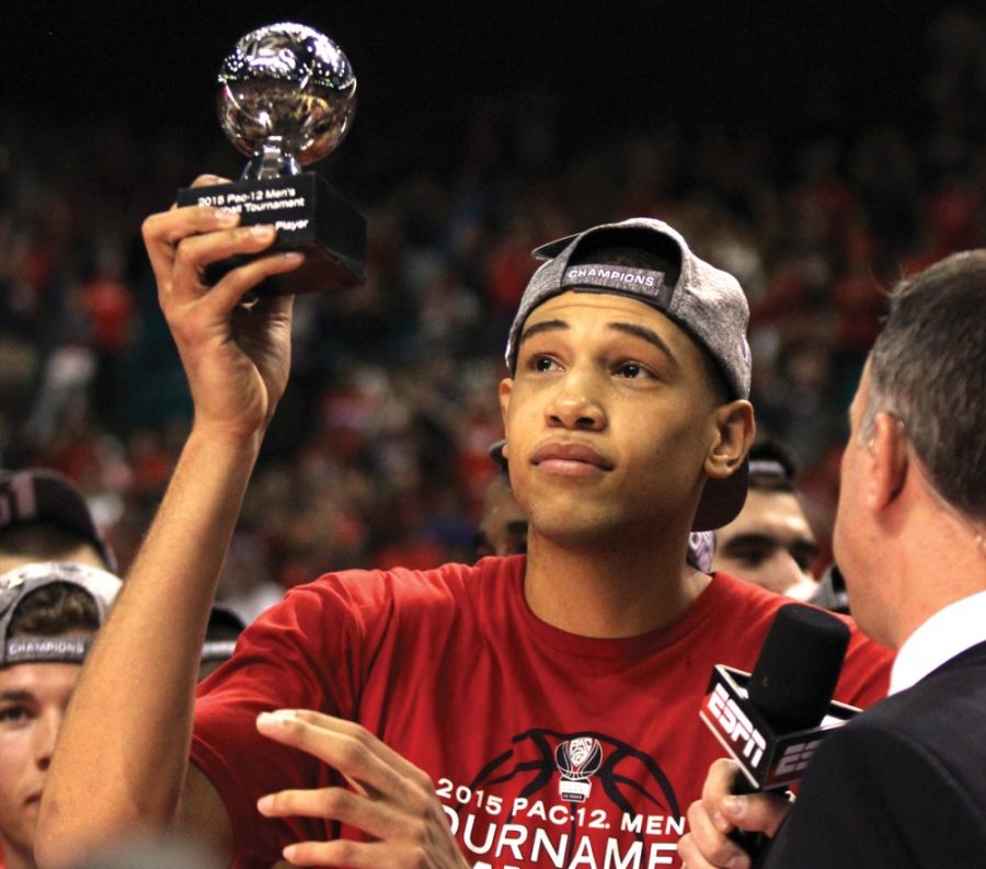 Then-Arizona forward Brandon Ashley (21) holds up his trophy to the crowd after recieving the Pac-12 Tournament Most Outstanding Player after Arizonas 80-52 win over Oregon in the MGM Grand Garden Arena in Las Vegas, Nev. on March 14. Ashley was a key player for the Wildcats in his three seasons in red and blue.