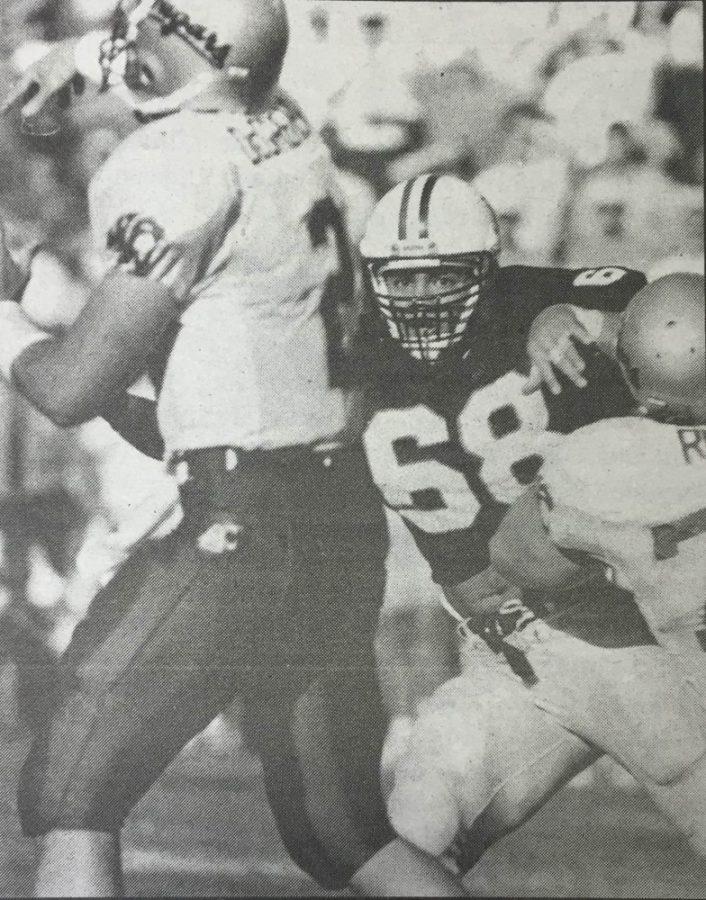 Sophomore defensive end Tedy Bruschi barrels through the Washington State offensive line in pursuit of Cougars quarterback Chad DeGrenier.