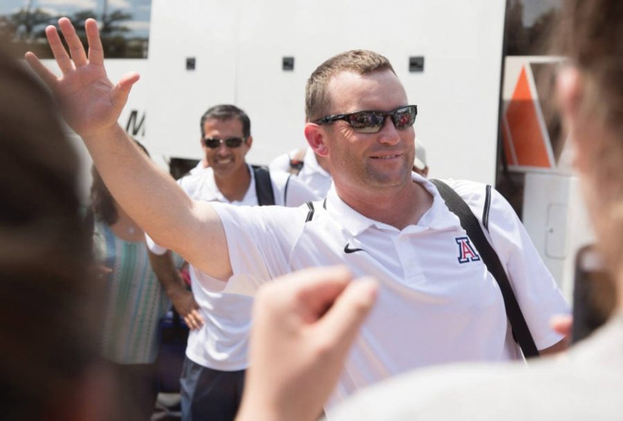 Arizona baseball head coach Jay Johnson waves to a crowd upon his arrival back to Tucson after winning the NCAA Super Regionals in Mississippi. 