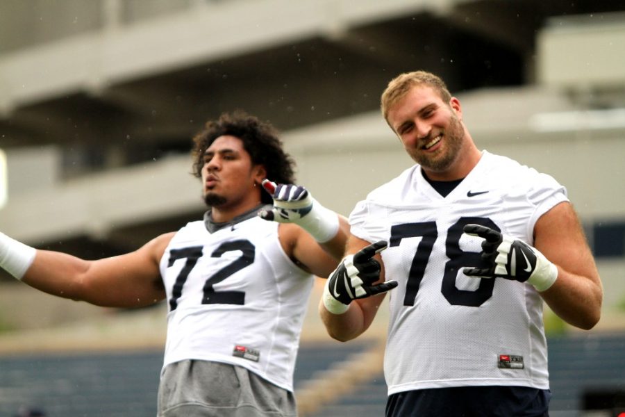 Arizona offensive linemen Feddie Tagaloa and Jacob Alsadek pose for a photo before practice on Friday, Aug. 5, 2016.