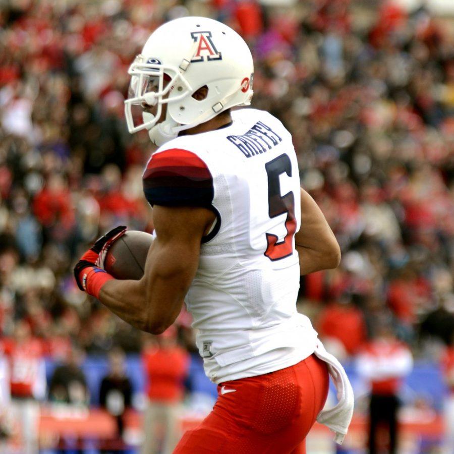 Arizona wide receiver Trey Griffey (5) runs with the ball after receiving a pass during the New Mexico Bowl in Albuquerque, New Mexico on Dec. 19, 2015. Griffey is expected to lead the Wildcats receiving core this season. 