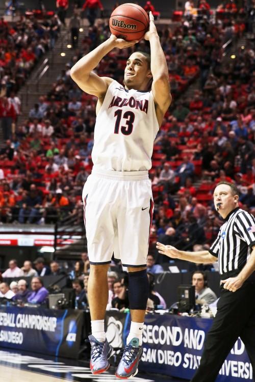 Arizona guard Nick Johnson (13) shoots a three-pointer during Arizonas 68-59 win against Weber State during the Second Round of the NCAA Tournament at the Viejas Arena in San Diego. on Friday, March 21, 2014. Johnson holds camps for kids several times throughout the summer in Tucson and Glendale, Arizona.
