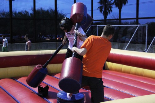 Engineering management freshman Drew Pasma (right) jousts with pre-business freshman Zac Rucas (left) during UA Campus Recreations Meet Me at the Rec event on Aug. 25, 2015 at William David Sitton Field. The jousting inflatable was one of the more popular activities at the event.