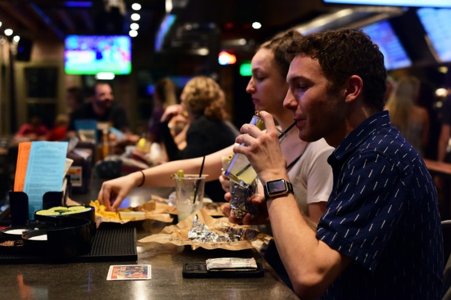 First year graduate student in higher education Jayson Astor sips a $4 margarita during their daily happy hour special at Illegal Petes on University Boulevard on Tuesday, Sept. 6, 2016. Astor is a regular at Illegal Petes - according to his friend Claire Showerman, he lives here. 
