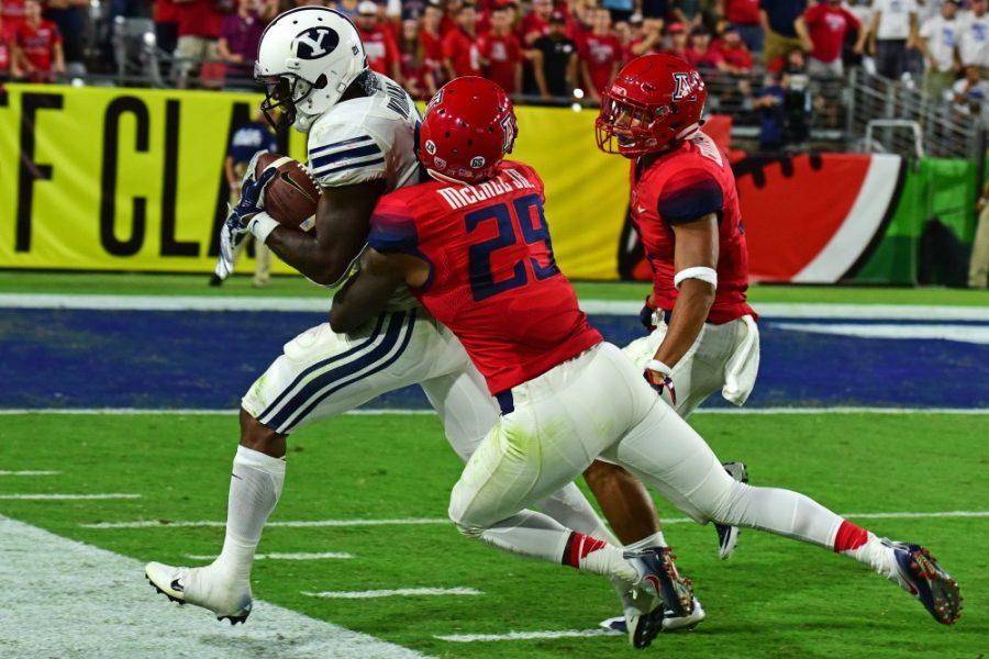 Arizona safety Jarvis McCall Jr. (29) sends BYU offense sailing out of bounds during Arizonas 18-16 loss to BYU in the Cactus Kickoff Classic at the University of Phoenix Stadium on Saturday, Sept. 3.