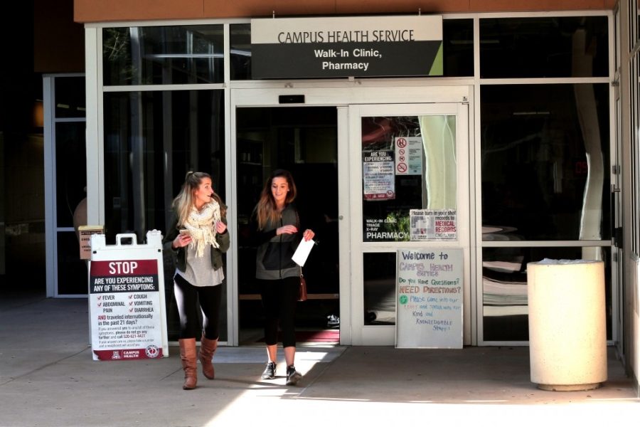 UA nutritional sciences students Kiersten Kunkle (left) and Macie Andrews (right) walk out of the Campus Health Center on Feb. 5. 