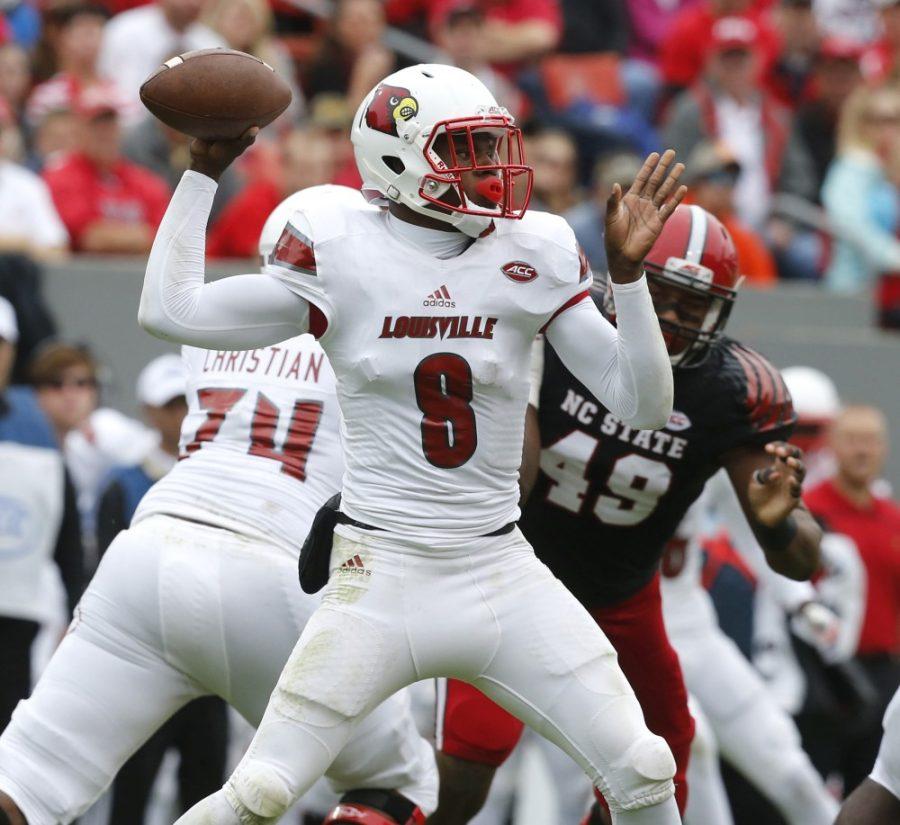 Louisville quarterback Lamar Jackson (8) passes during the first half against North Carolina State at Carter-Finley Stadium in Raleigh, N.C., on Saturday, Oct. 3, 2015. Louisville won, 20-13. (Ethan Hyman/Raleigh News & Observer/TNS)