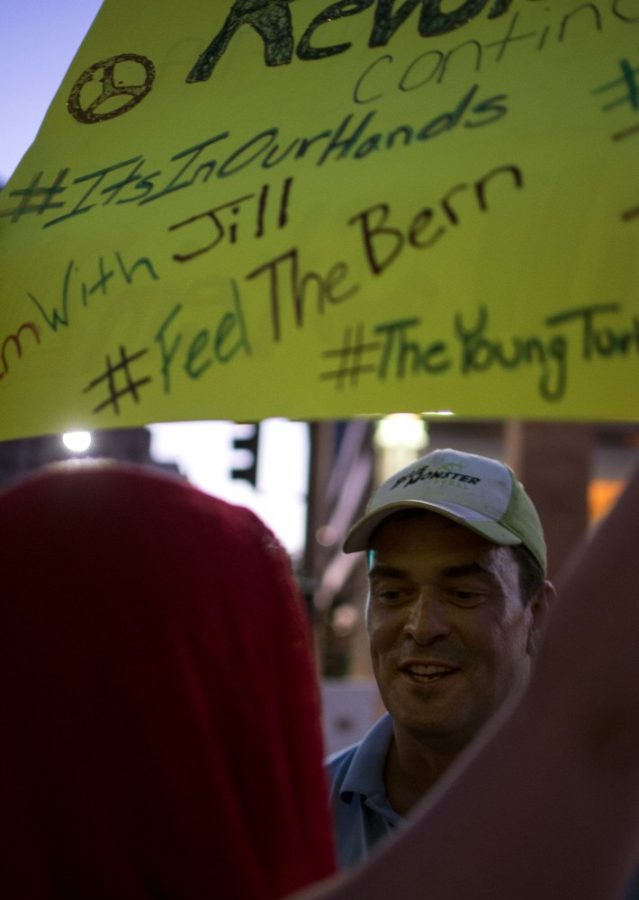Matthew Gramlich, right, harrasses Jill Stein supporter Nadea Tanzadeh, left, outside a rally for GOP presidential nominee Donald Trump at the Phoenix Convention Center, located at 100 N Third St. in Phoenix. Tanzadeh attended the event to spread the word about Jill Stein, the Green Party candidate.