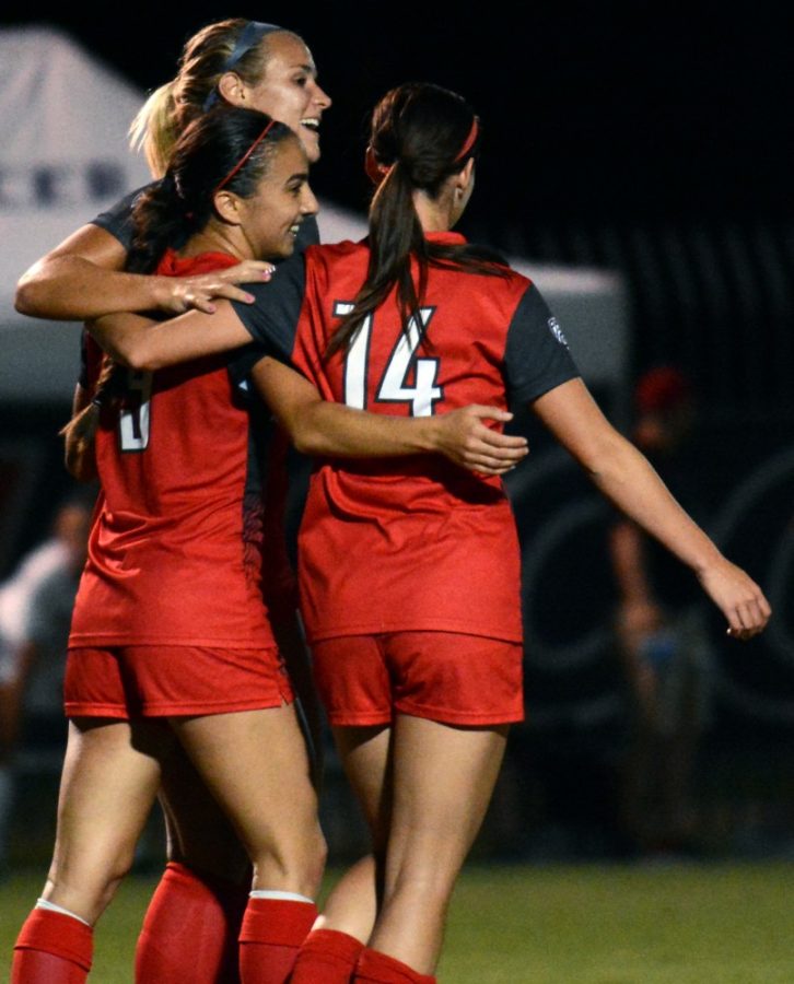 Arizona midfielders Hailey Mazzola (17) and Jaden DeGracie-Bailey (14) congratulate Arizona midfielder Gabi Stoian (9) after her goal during the first round of the Arizona Cats Classic against Northern Illinois University at Murphey Field at Mulcahy Soccer Stadium in Tucson, Ariz. on Friday, Sept. 9, 2016. The Wildcats beat the Huskies 2-0.