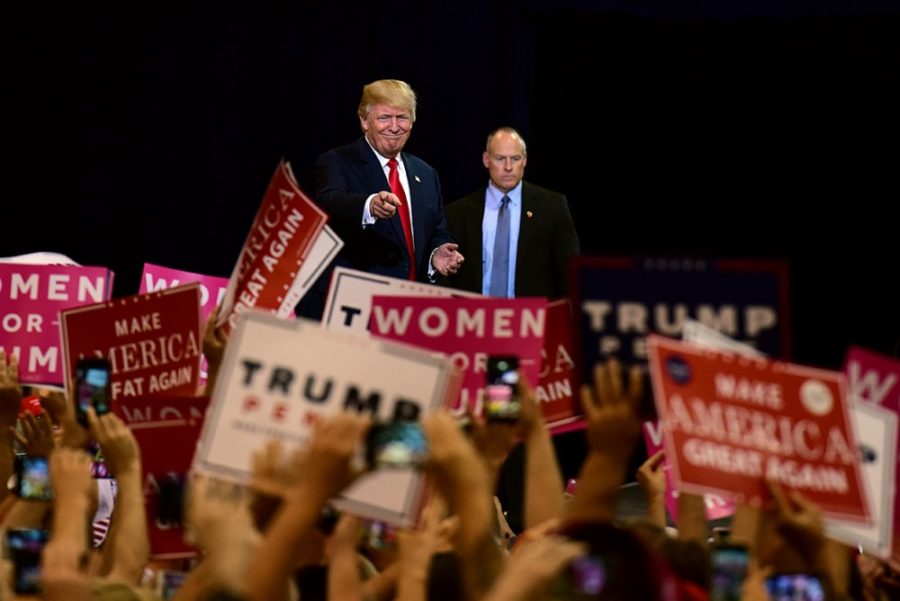 Republican+presidential+candidate+Donald+Trump+plays+to+the+crowd+as+he+walks+to+the+podium+during+a+rally+at+the+Phoenix+Convention+Center+on+Saturday%2C+Oct.+29%2C+2016.+