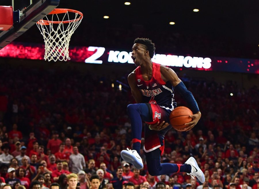 Arizona guard Kobi Simmons (2) soars up to the basket in the slam dunk contest during the red and blue scrimmage at McKale Center on Friday, Oct. 14, 2016. 