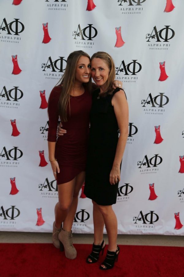 Courtesy Sabrina DeSisti. Sabrina DeSisto and her mom, Chelley DeSisto, pose at Alpha Phis 2015 Red Dress gala. The gala is an annual philanthrophy hosted every year during Family Weekend.