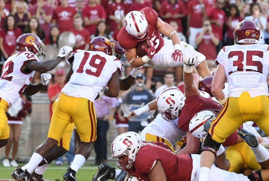 Stanford's Christian McCaffrey (5) dives over the USC defenders but comes up short at the 1-yard line in the second quarter at Stanford Stadium in Palo Alto, Calif., on Saturday, Sept. 17, 2016. (Wally Skalij/Los Angeles Times/TNS)