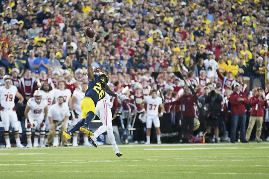 Michigan cornerback Jourdan Lewis clenches Michigans victory over Wisconsin with a one-handed interceptuon on Saturday, Oct. 1 in Ann Arbor, Mich. 