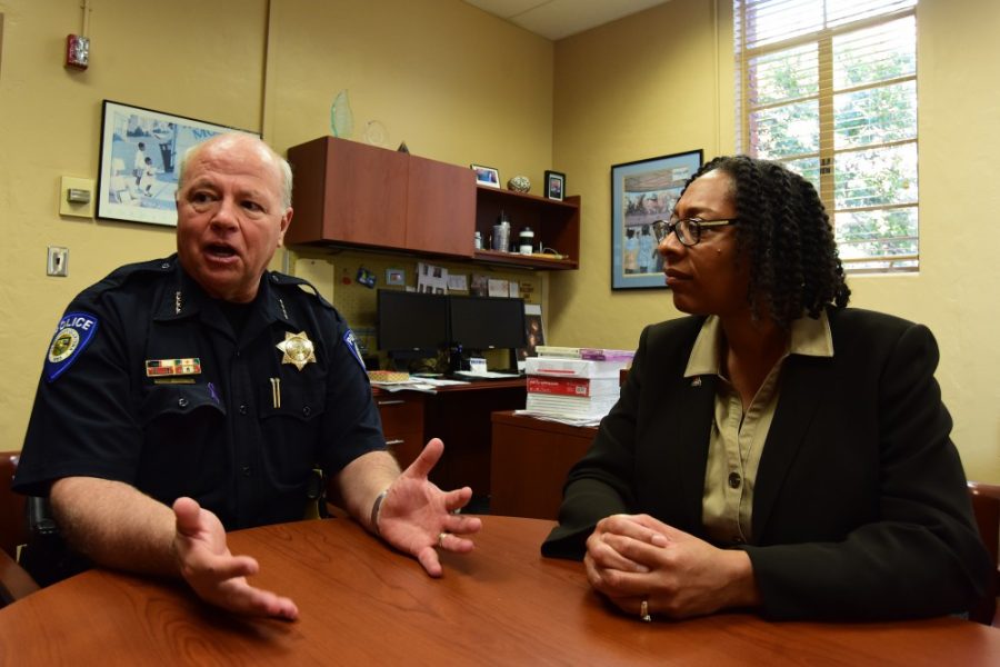 UA Chief of Police Brian Seastone, left, and Dean of Students Kendal Washington White, right, discuss the panic over non-existent clowns that purportedly terrorized the UA campus late Monday night in Whites office in the Nugent Building on Wednesday, Oct. 5, 2016. 