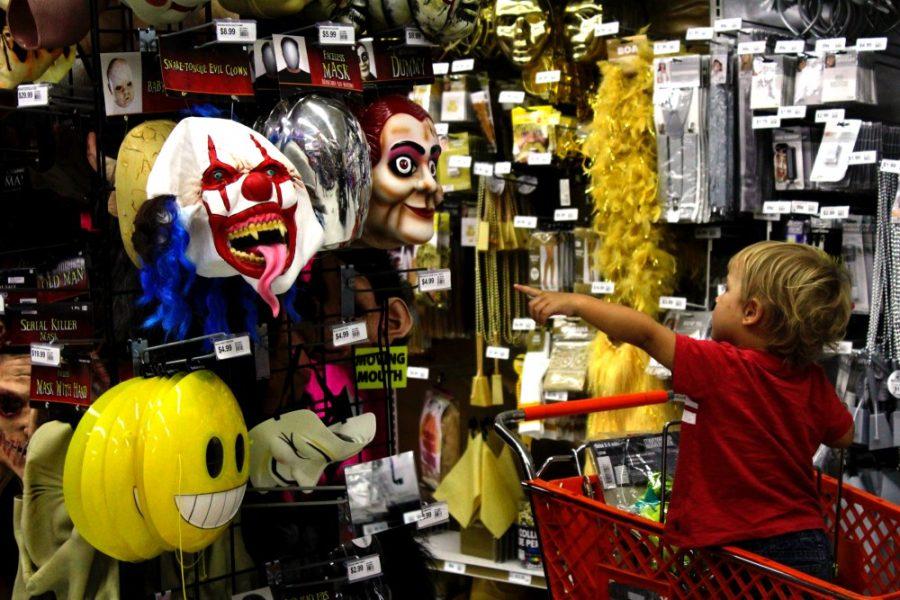 Jaxson Palma points to a clown mask in Party City on Broadway Blvd. and Craycroft Rd on Oct. 28, 2016. The popularity of clown costumes exploded this year due to the various clown sightings around the country.