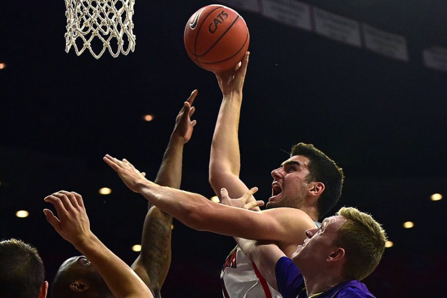Arizona center Dusan Ristic (14) overcomes Idaho College defense during Arizonas blow-out 86-35 exhibition win over the College of Idaho at McKale Center on Tuesday, Nov. 1, 2016. 