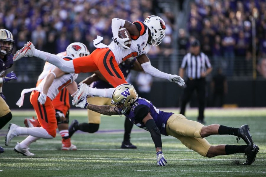 Washington+defensive+back+Sidney+Jones+%2826%29+tackles+Oregon+State+wide+receiver+Victor+Bolden+Jr.+%286%29+for+a+loss+in+the+first+quarter+on+Saturday%2C+Oct.+22%2C+2016%2C+at+Husky+Stadium+in+Seattle.+Washington+won%2C+41-17.+%28Johnny+Andrews%2FSeattle+Times%2FTNS%29