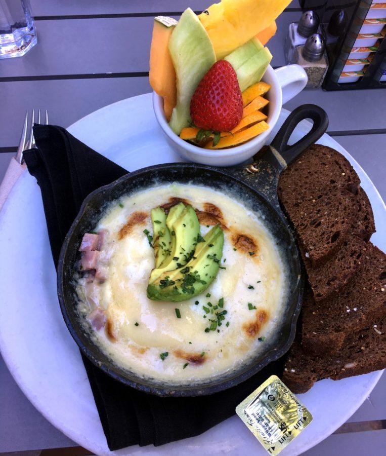 Cup Cafes Cast Iron Baked Eggs won the Arizona Foodist Award for Best Breakfast Dish in 2015. The dish is cooked in a cast iron skillet and includes two eggs, ham, leeks, gruyère cheese, cream, fines herbes, hotel potatoes and toast. 