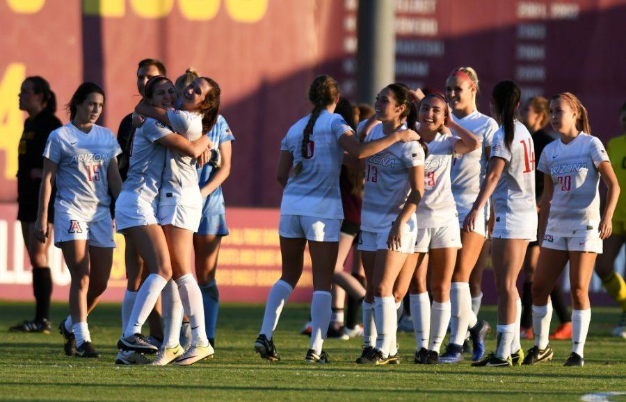 The Arizona Wildcats celebrate after their win over ASU at Sun Devil Soccer Stadium in Tempe on Friday, Nov. 4, 2016. The Wildcats shut out the Sun Devils 1-0 for their first Territorial Cup win in soccer since 2013.