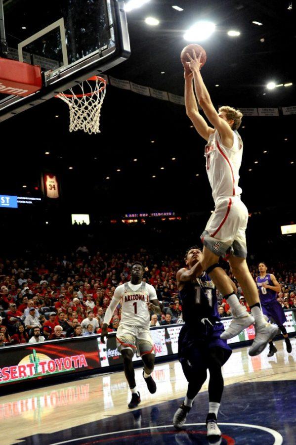 Arizona+forward+Lauri+Markkanen+launches+upward+for+a+dunk+against+the+College+of+Idaho+during+Ariznas+exhibition+game+on+Tuesday%2C+Nov.+1+in+McKale+Center.