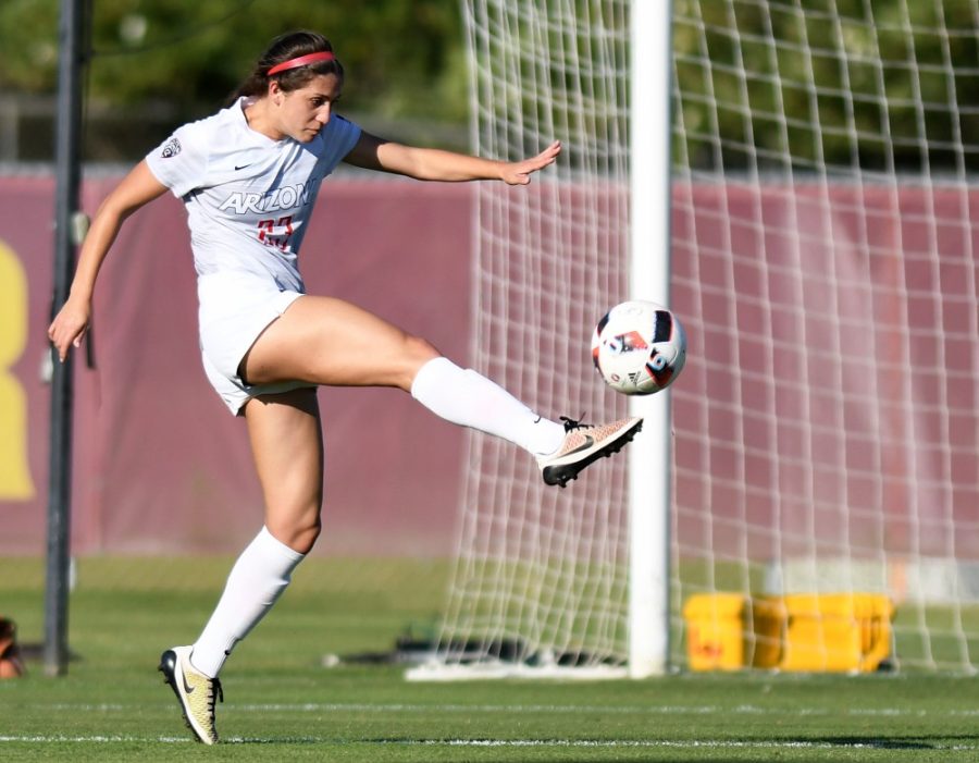 Arizona defender Samantha Falasco (23) tries to move the ball out of Arizona territory while playing against ASU at Sun Devil Soccer Stadium in Tempe on Friday, Nov. 4, 2016. The Wildcats shut out the Sun Devils 1-0 for their first Territorial Cup win in soccer since 2013.