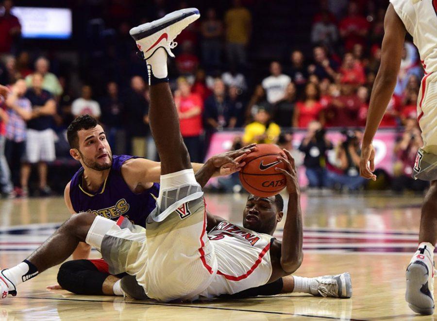 Arizona guard Kadeem Allen (5) clambers for the ball against Idaho College center Aitor Zubizarreta (45) during Arizonas blow-out 86-35 exhibition win over the College of Idaho at McKale Center on Tuesday, Nov. 1, 2016. 