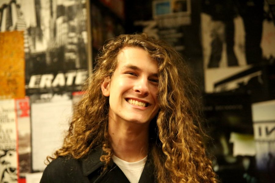 Colin Bauer, singer and guitarist for band Closet Goth, runs a record label called Warped Your Records. He is pictured here at KAMP radio station at the Park Student Union on Jan. 28, where he is alternative music director.